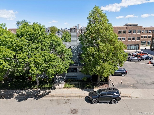 11 W Ellsworth Ave Unit 22, Denver, CO 80223 - view of building exterior featuring uncovered parking