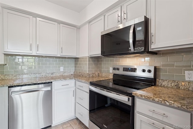 11 W Ellsworth Ave Unit 22, Denver, CO 80223 - kitchen with appliances with stainless steel finishes, white cabinets, light stone counters, and backsplash