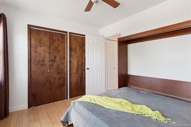 11 W Ellsworth Ave Unit 22, Denver, CO 80223 - bedroom featuring multiple closets, light wood-style flooring, and a ceiling fan