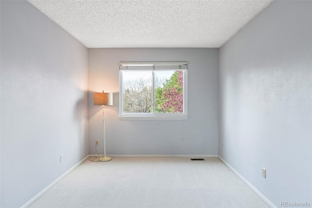 14084 E Hampden Pl, Aurora, CO 80014 - empty room featuring carpet flooring, a textured ceiling, and baseboards