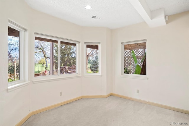 14084 E Hampden Pl, Aurora, CO 80014 - spare room featuring carpet flooring, visible vents, and a textured ceiling