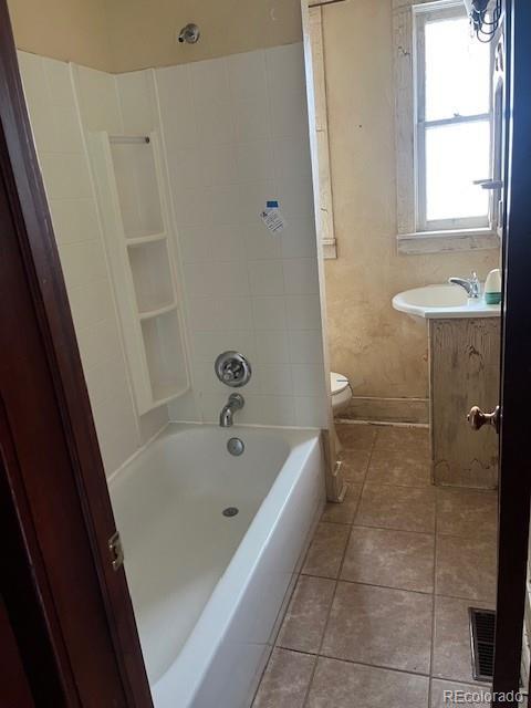 full bathroom featuring tile patterned flooring, vanity, tub / shower combination, and toilet