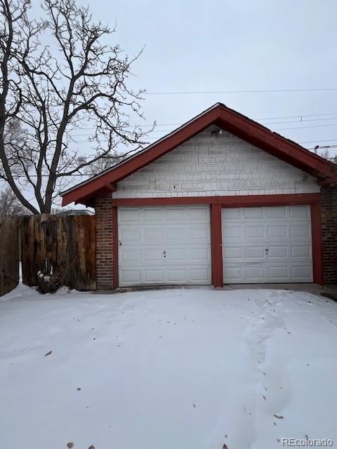 view of snow covered garage