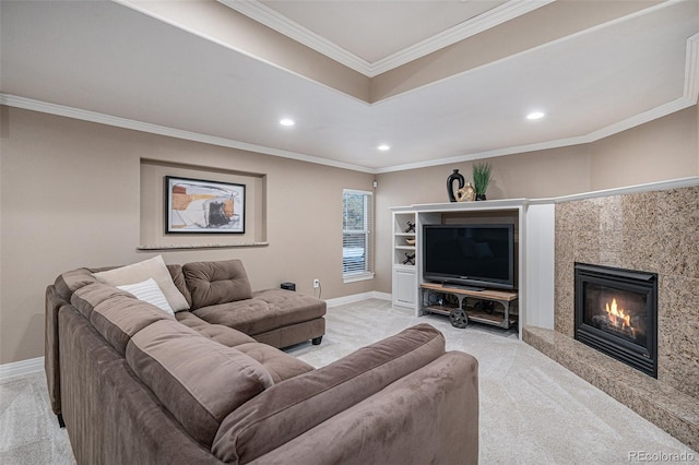 living area featuring light carpet, baseboards, a premium fireplace, ornamental molding, and recessed lighting