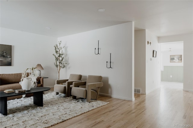 living room with light hardwood / wood-style flooring