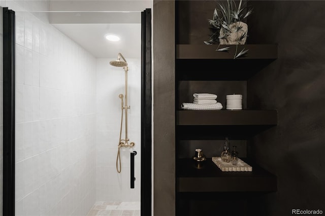 bathroom with tiled shower