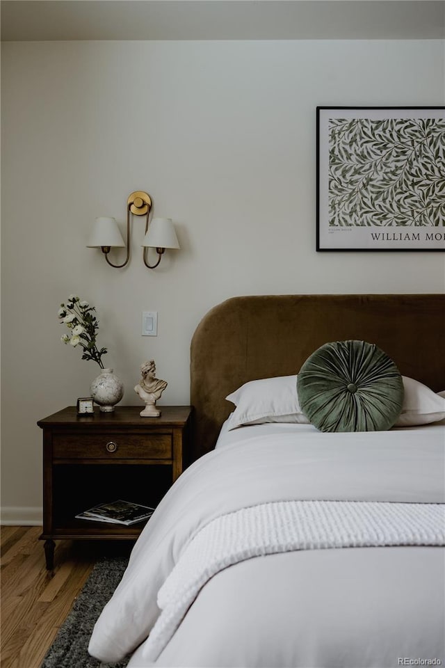 bedroom with wood-type flooring