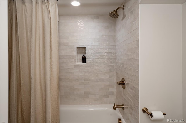 bathroom featuring shower / bathtub combination with curtain