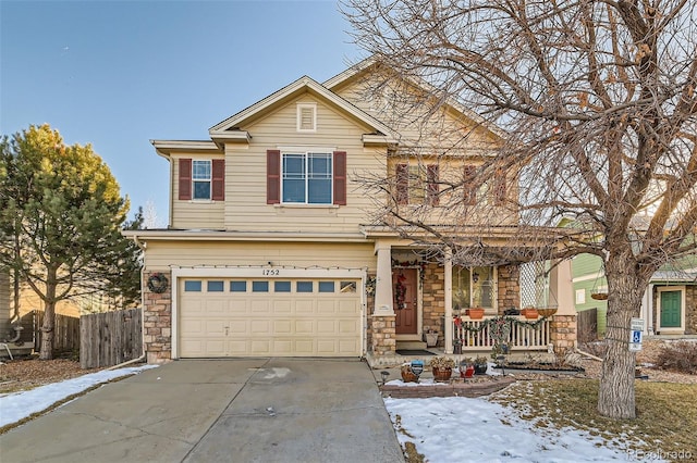 view of front of home featuring a garage and a porch