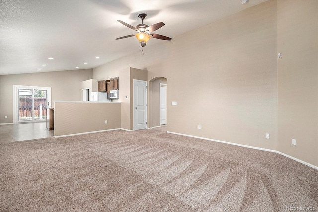 interior space featuring ceiling fan and vaulted ceiling