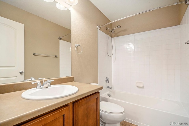 full bathroom featuring vanity, tub / shower combination, and toilet