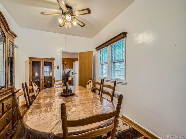 dining space featuring hardwood / wood-style flooring and ceiling fan