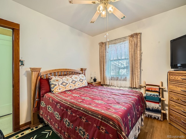 bedroom featuring hardwood / wood-style flooring and ceiling fan