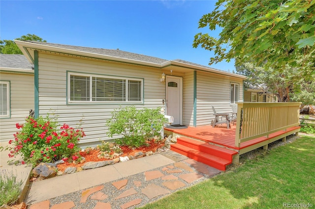 view of front of home featuring a wooden deck