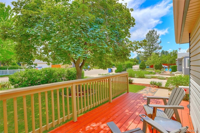 wooden deck with a lawn