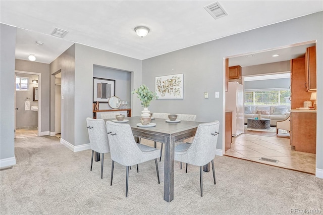 dining area with light carpet