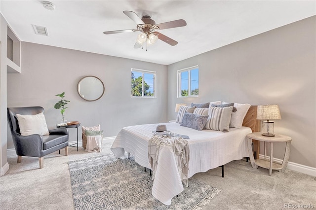 bedroom with light colored carpet and ceiling fan