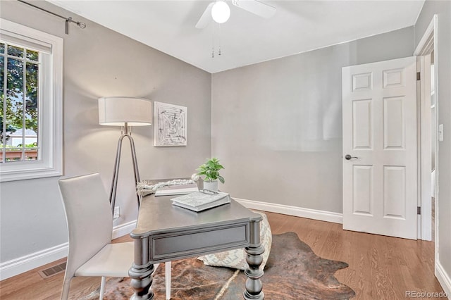 home office with ceiling fan and wood-type flooring