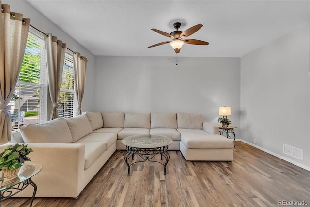 9758 Laredo St Unit 35B, Commerce City, CO 80022 - living area featuring ceiling fan, wood finished floors, and baseboards