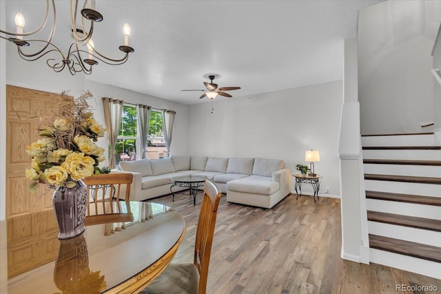 9758 Laredo St Unit 35B, Commerce City, CO 80022 - living area featuring ceiling fan, light wood-style floors, a chandelier, stairs, and baseboards