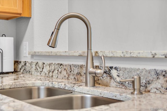 9758 Laredo St Unit 35B, Commerce City, CO 80022 - kitchen view of a sink, light countertops, and decorative backsplash