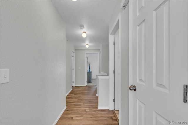 9758 Laredo St Unit 35B, Commerce City, CO 80022 - hallway with baseboards and light wood-style floors