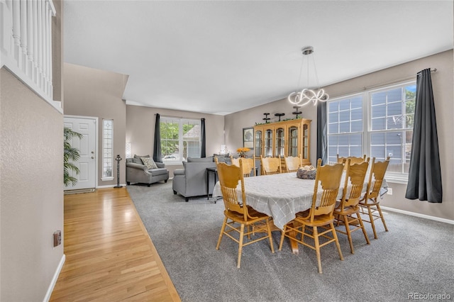 2938 S Zeno Way, Aurora, CO 80013 - dining space featuring wood finished floors and a chandelier
