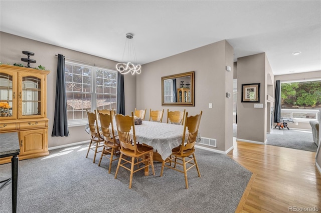 2938 S Zeno Way, Aurora, CO 80013 - dining area featuring light wood-style flooring, a chandelier, and recessed lighting