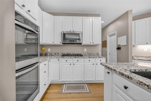 2938 S Zeno Way, Aurora, CO 80013 - kitchen featuring stainless steel appliances, light wood-style floors, white cabinetry, and recessed lighting