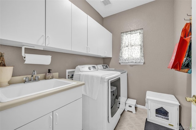 2938 S Zeno Way, Aurora, CO 80013 - laundry room featuring washing machine and clothes dryer and cabinet space