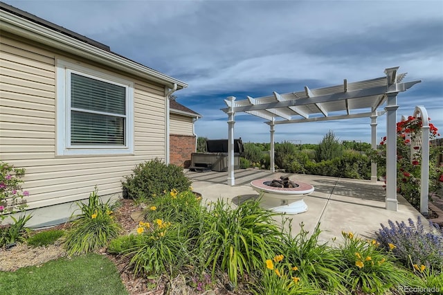 view of patio / terrace featuring a fire pit and a pergola