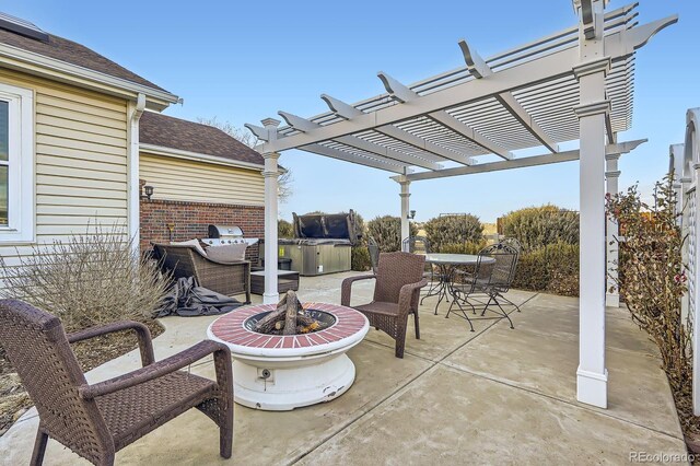 view of patio / terrace with an outdoor fire pit, a pergola, and outdoor dining space