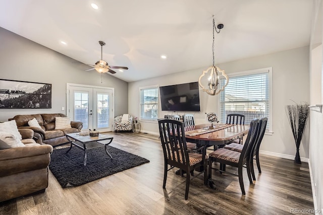 dining room with lofted ceiling, french doors, and dark wood finished floors