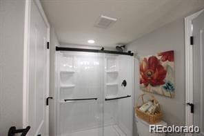 full bath featuring a shower stall