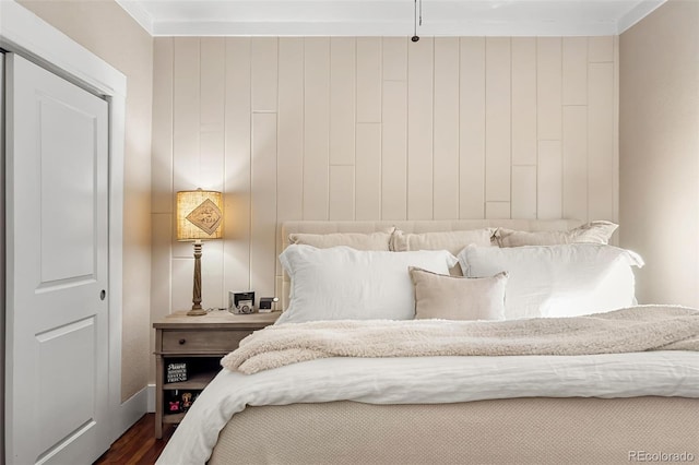 bedroom featuring dark wood-style flooring