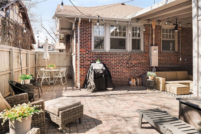 view of patio / terrace with outdoor dining space and a fenced backyard