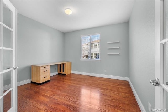 office area featuring dark wood-type flooring and french doors