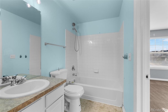 full bathroom featuring vanity, tiled shower / bath combo, tile patterned floors, and toilet