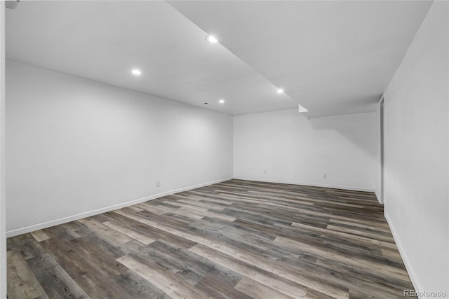 empty room featuring dark hardwood / wood-style flooring