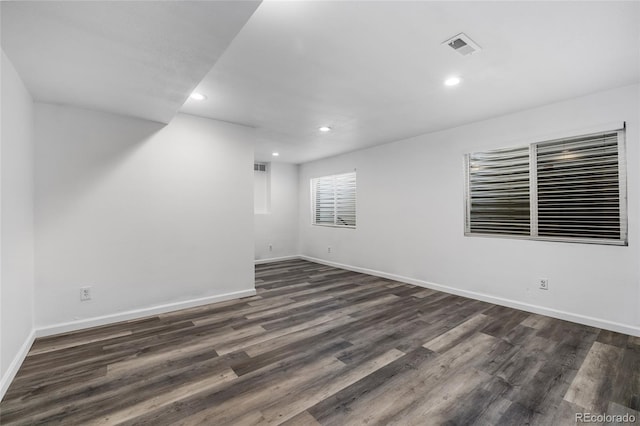 empty room featuring dark hardwood / wood-style floors