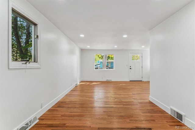 spare room featuring light wood-type flooring