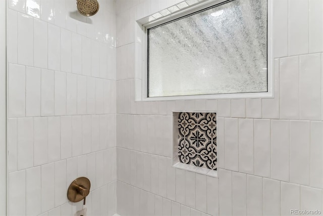 bathroom with tiled shower