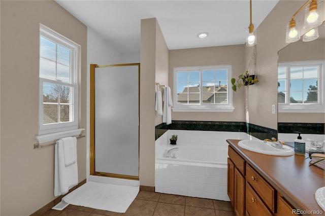 10087 E Hawaii Pl, Aurora, CO 80247 - full bathroom with tile patterned flooring, a garden tub, a shower stall, and double vanity