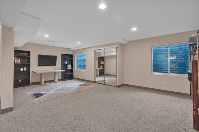 10087 E Hawaii Pl, Aurora, CO 80247 - unfurnished living room with carpet and recessed lighting