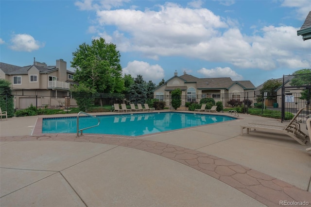10087 E Hawaii Pl, Aurora, CO 80247 - community pool featuring a patio and a residential view