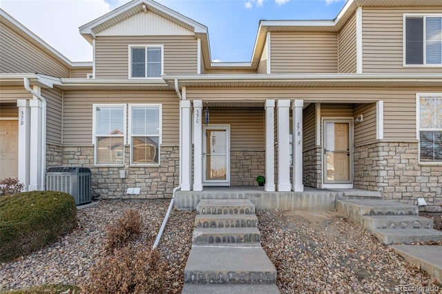 view of front of property featuring central AC unit and covered porch