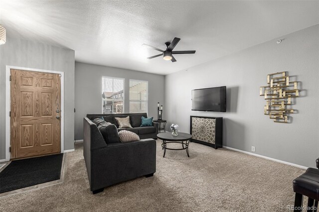 9758 Laredo St Unit 37C, Commerce City, CO 80022 - living area with ceiling fan, carpet flooring, and baseboards