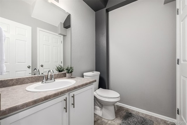 9758 Laredo St Unit 37C, Commerce City, CO 80022 - bathroom with vanity, toilet, and baseboards