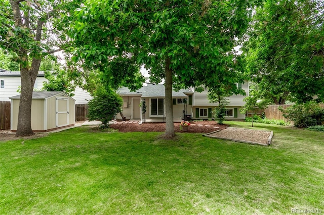 2212 S Naples Way, Aurora, CO 80013 - back of house with a storage shed and a patio area