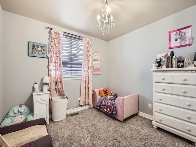 bedroom featuring carpet and an inviting chandelier